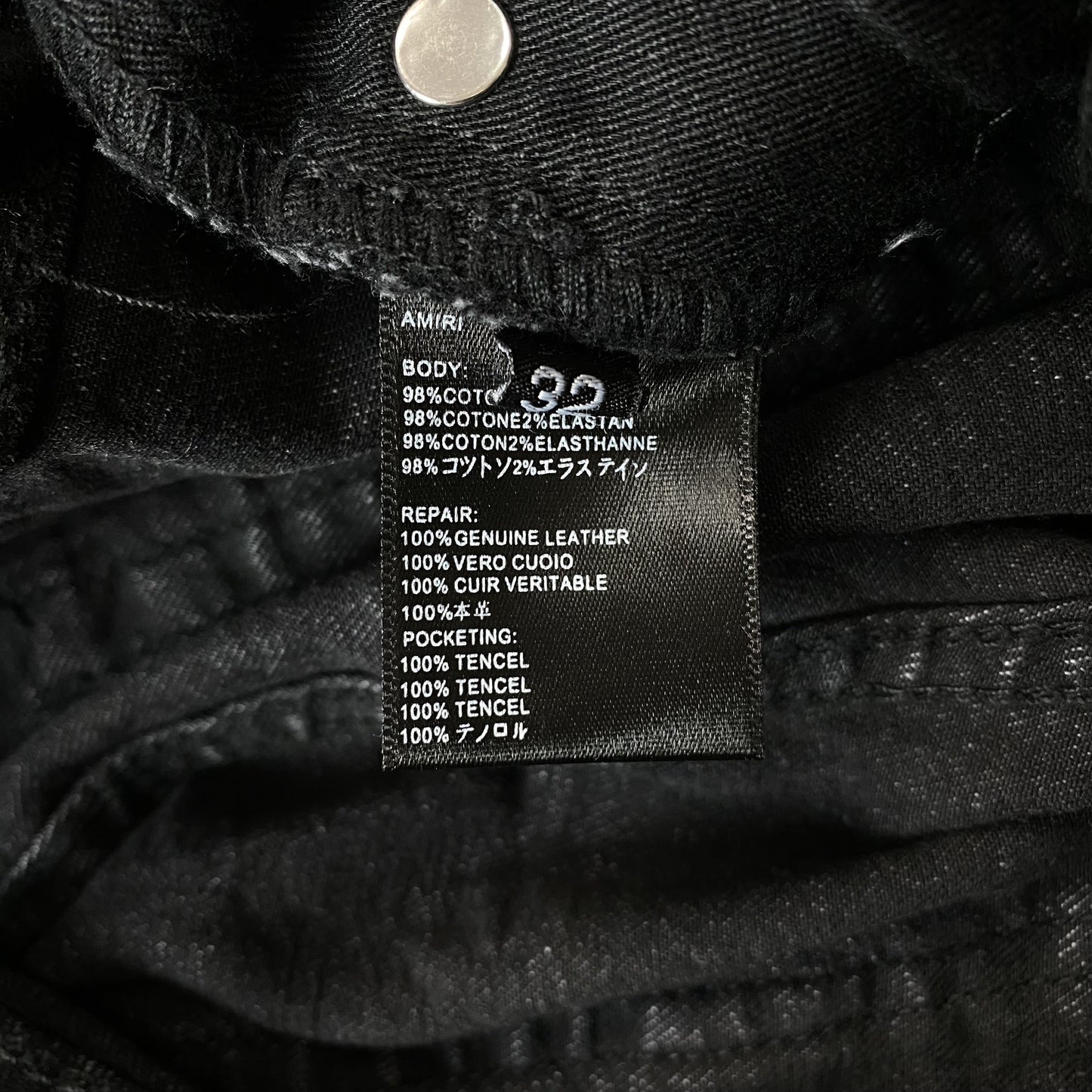 AMIRI VARSITY LOGO REPAIR JEANS
