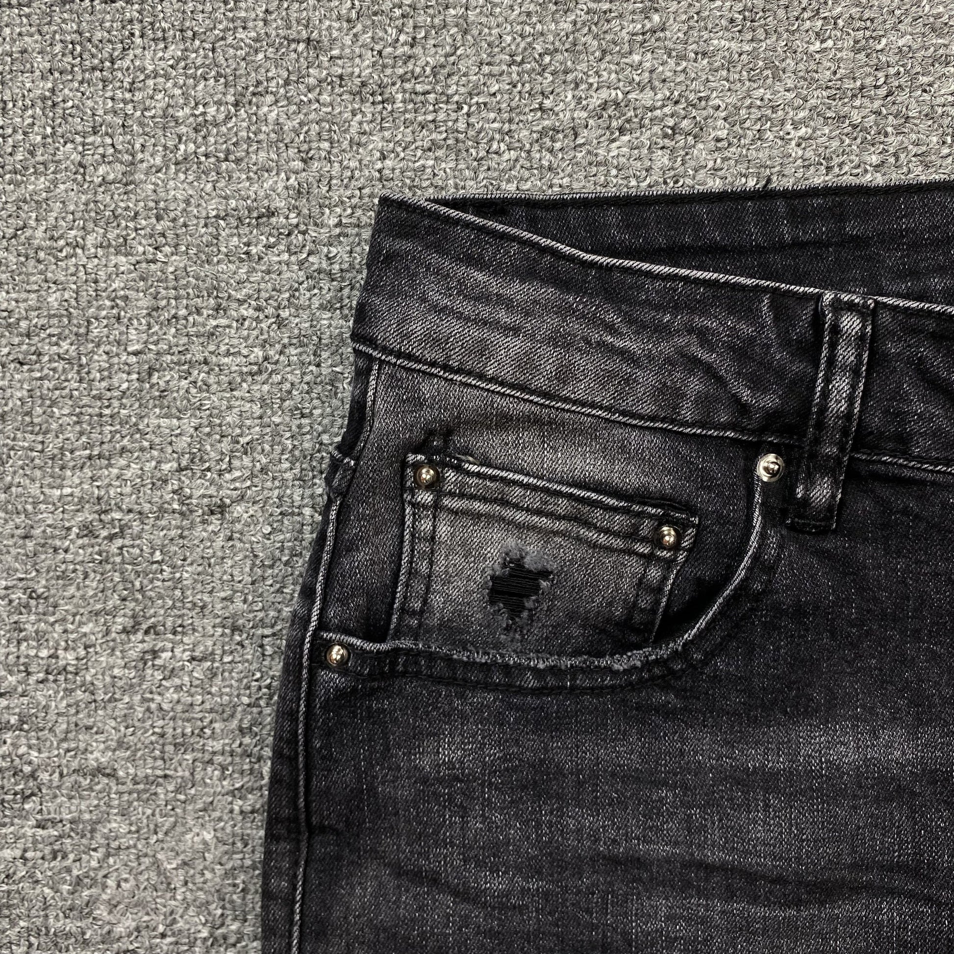 AMIRI VARSITY LOGO REPAIR JEANS