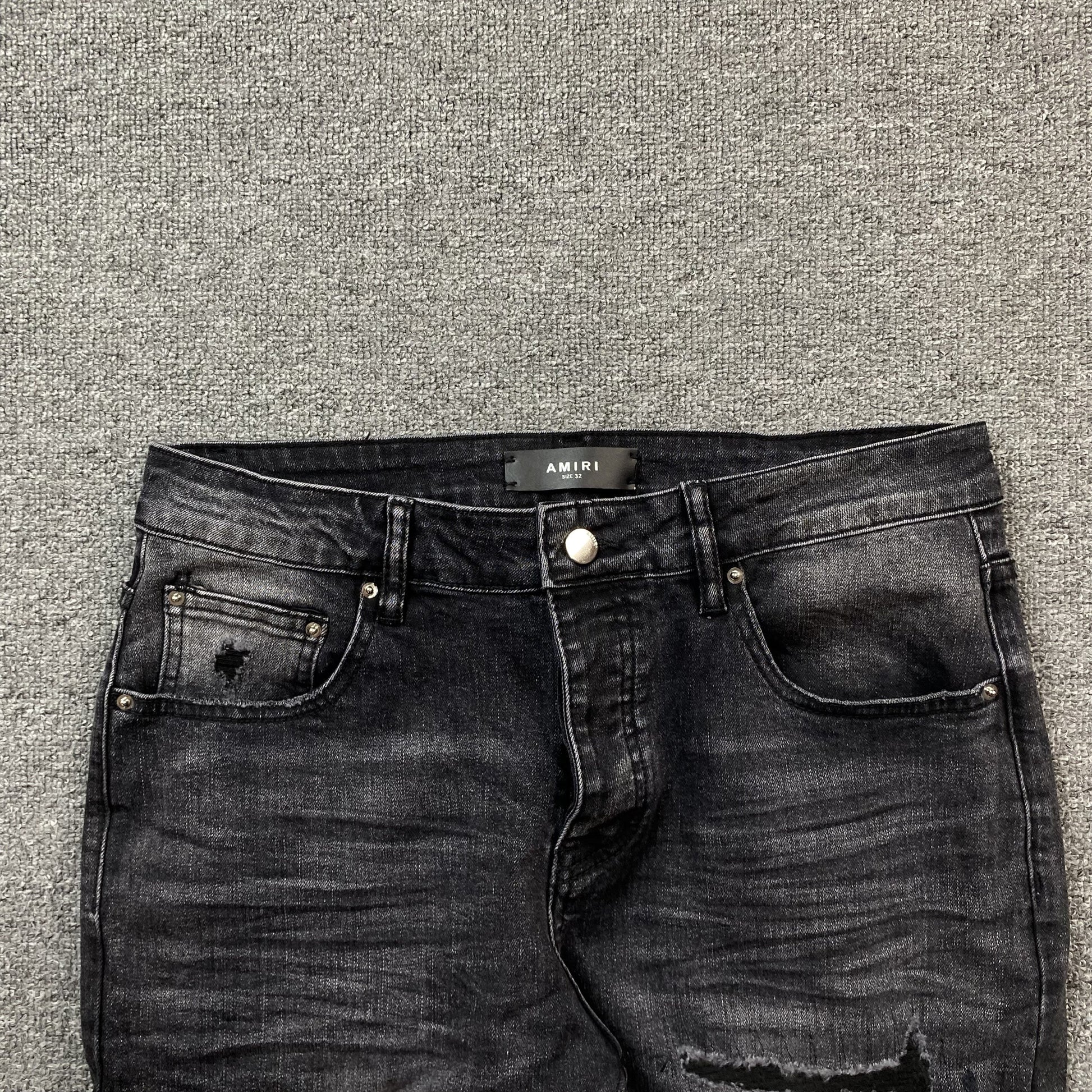 AMIRI VARSITY LOGO REPAIR JEANS