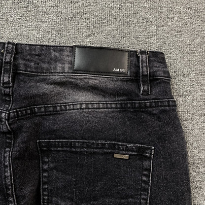 AMIRI VARSITY LOGO REPAIR JEANS